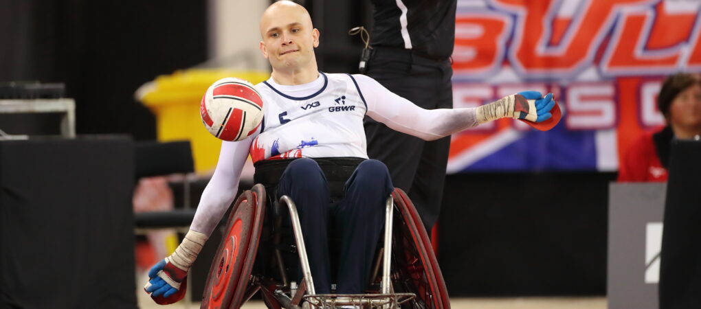 Jack Smith Punting the ball in a wheelchair rugby match