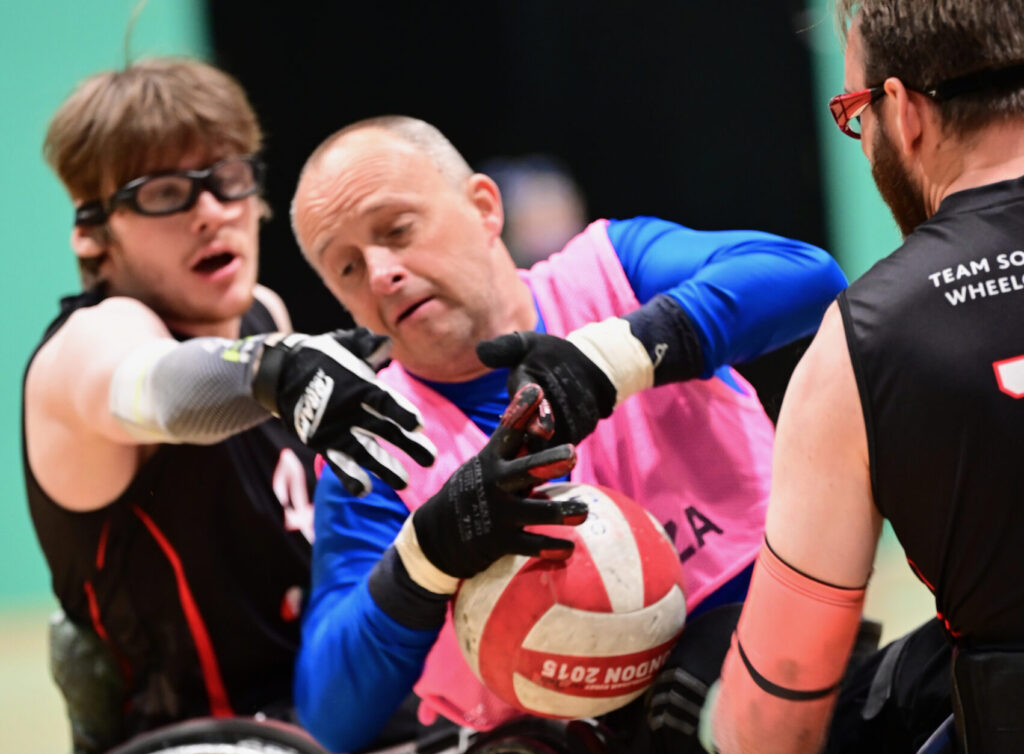 3 players fighting for the ball