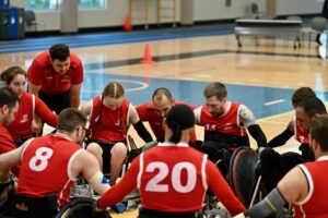 GB Talent team in a huddle all touching each other, while they shout